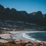 Scenic view of Camps Bay beach with Twelve Apostles mountains. Perfect for travel, nature, and landscape photography lovers.