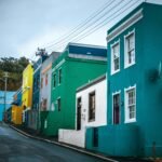 Colorful row of traditional Bo-Kaap houses in Cape Town on an overcast day.