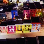 Aerial view of Bo-Kaap's colorful houses in Cape Town, South Africa, illuminated at night.