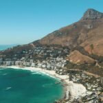 A breathtaking aerial photograph capturing the coastal beauty of Cape Town's Lion's Head and beaches.